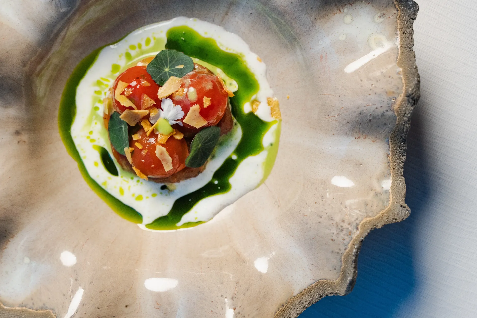 Tomato signature dish on textured plate